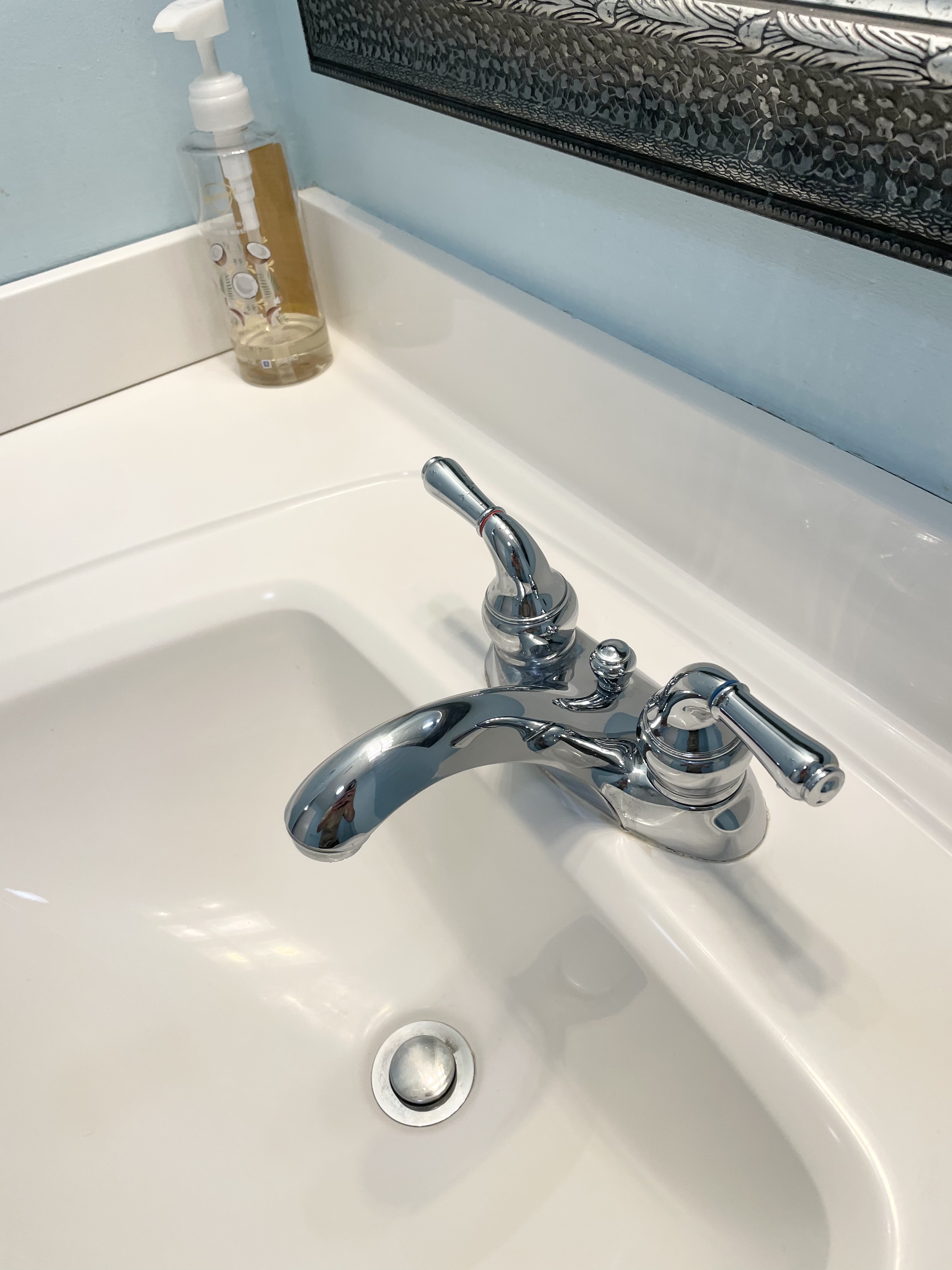 A freshly cleaned bathroom sink in a residential home.