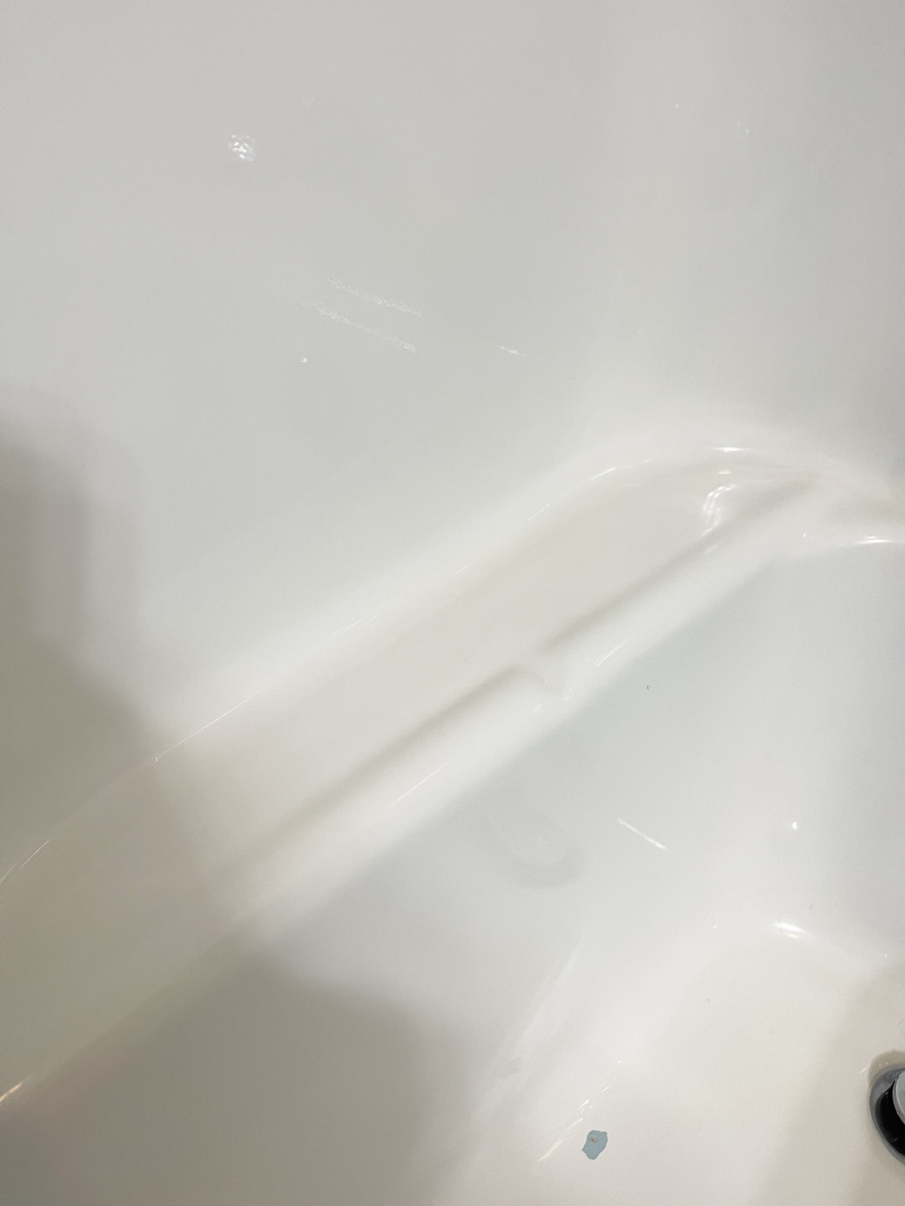 Bathtub after being scubbed clean from black mold and scuff marks.